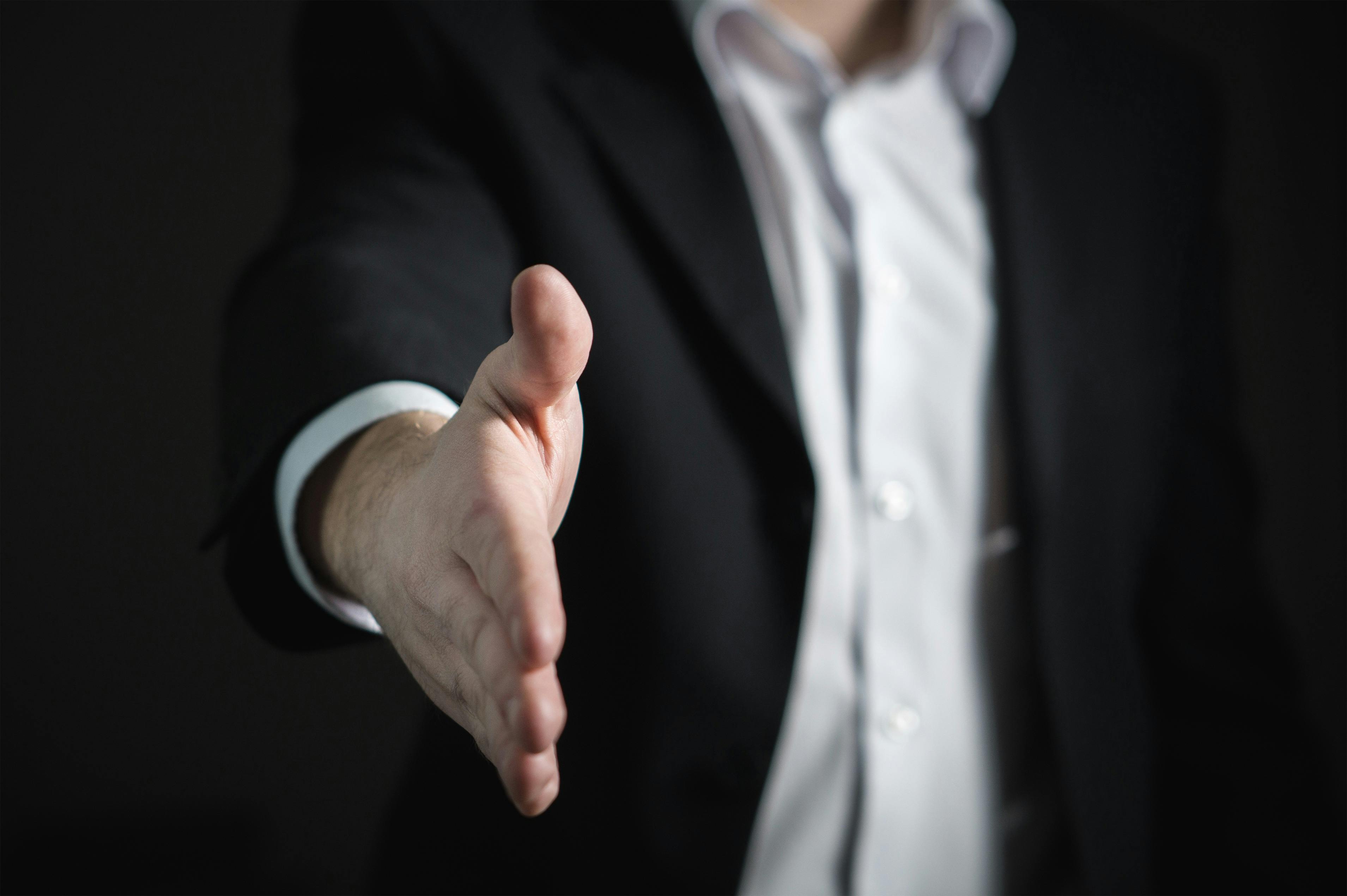 Professional offering a handshake